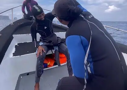 Group of divers preparing for Bali diving in Nusa Penida with clear blue skies.